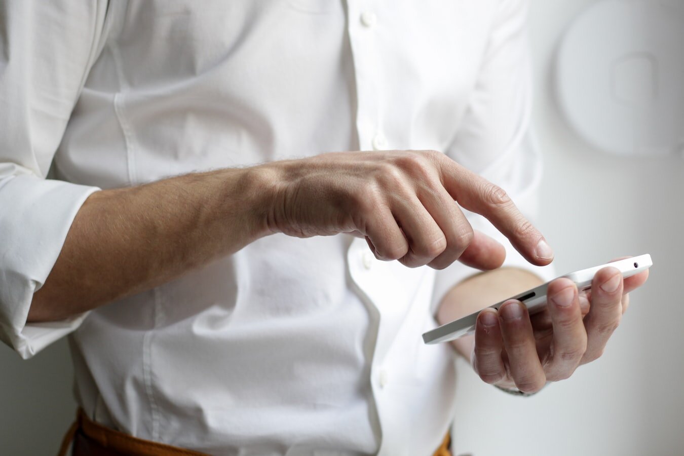 man using apps on his smartphone